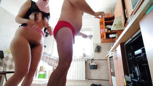 Scorching inexperienced duo having joy in the kitchen.