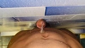 Uncut dick pissing hot pee between wall and the belly piss fountain allover the belly button & chest