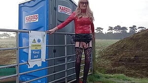 Vinyl dressed in Crossdresser Outdoors Posing and urinating