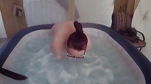 schoolgirl tart with white stockings in the hot tub
