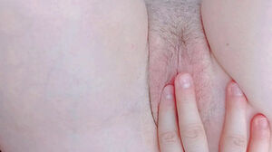 Opening her smallish unshaved twat slot