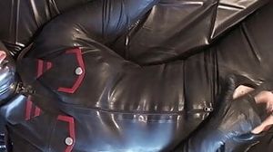 Latex Danielle masturbating in Army catsuit with latex mask and gloves