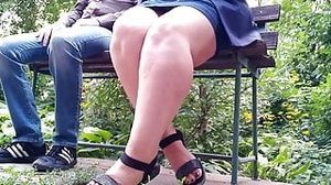 Hot milf spread her legs wide pissing on a park bench man just watched