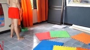 Naturist maid cleans the yoga guest room. A bare cleaner cleans mirrors, sweeps and mops the floor. Ñ2