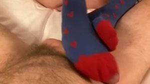 Pregnant footjob tease in blue and red socks