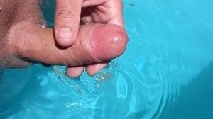 Observe as my pecker gets rock-hard in the pool