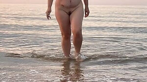 Naturist cougar on the beach