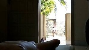 Wife takes a sunbath and displays her nude body to delivery man