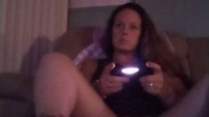 Filming up cougar in high high-heeled slippers dressed in mini sundress while she plays fortnite
