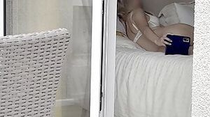 Hot spanish girl was secretly filmed in her hotel room through the window while she was taking some nude photes.