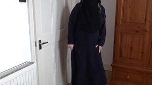 Pallid flesh cougar in Burqa and Niqab and High high-heeled shoes Dancing