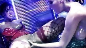 Dirty lesbians with big boobs fucking at the strip club using the strapon like crazy
