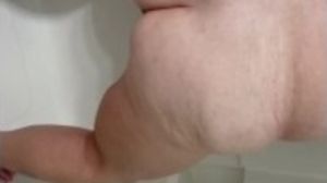 Mature peeing in toilet and shower