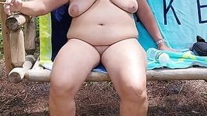 Chubby BBW Twinkie - i'm outside relaxing nude and barefoot on a swing in the woods while smoking mature milf