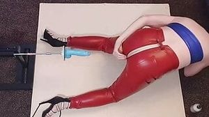 Ass fucked by the machine in red leather jeans