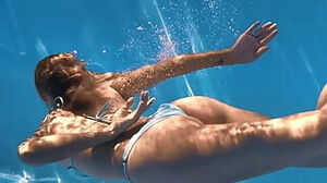 Sofi Otis swimming sexually in the pool