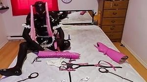 Sissy Maid in Armbinder and Ankle handcuffed to couch in virginity