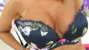 UK milf Charn lowers her knickers and starts fingering