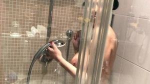 Busty, exotic MILF Kira Queen gets horny in the shower
