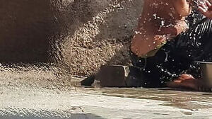 Indian sister is bathing in the open courtyard of the building, putting a finger in her burrow and fumbling the bod, sister is washing the douche.