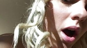 Blond in lingerie blows hairy dick and gets cum on face